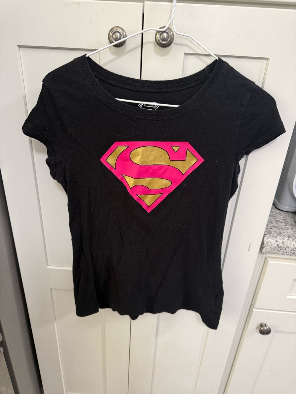 DC Comics Girls' Black Tee with Pink & Gold Supergirl Emblem